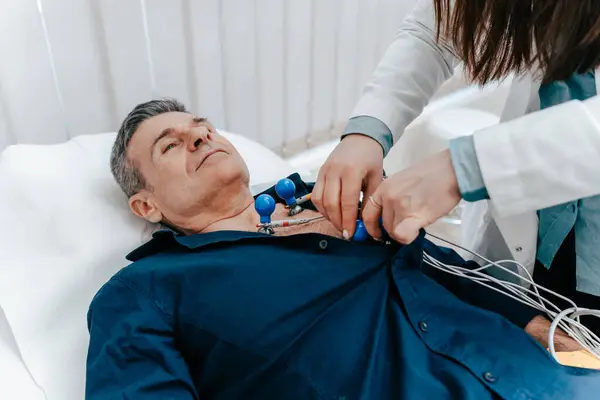 Experienced Doctor Putting Electrodes Ecg Machine Bare Torso Senior Male — Stock Photo, Image