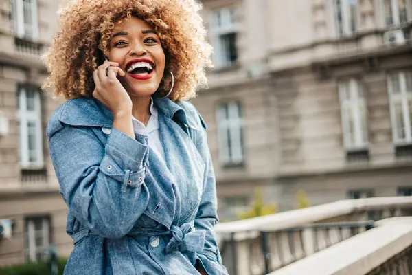 Beautiful Black Woman Walks Street Uses Smarphone Chat Messaging Communication Стоковая Картинка