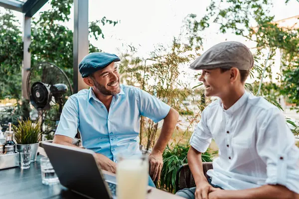 Handsome Happy Father His Teenager Son Sitting Restaurant Talking Stock Image