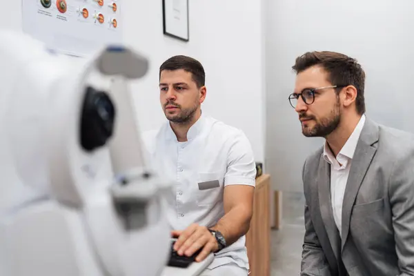 Attractive Male Doctor Ophthalmologist Checking Eye Vision Handsome Middle Age Stock Photo