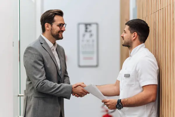 Handsome Male Patient Standing Talking Good Looking Male Doctor Hall Stock Photo
