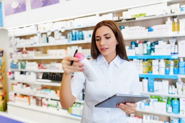 Beautiful Pharmacist Working Standing Drug Store Doing Stock Take Portrait Royalty Free Stock Images