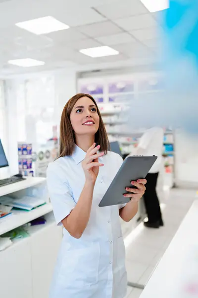 Two Beautiful Pharmacists Working Together Drug Store Doing Stock Take Stock Image