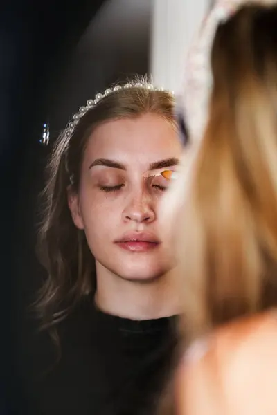 Professional Beautician Applying Makeup Beautiful Young Woman Face Professional Make Stock Photo