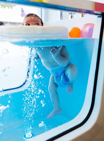 Small Child Baby Swimming Having Pleasant Time Physical Therapy Session Royalty Free Stock Images