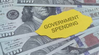 Examine government spending with this US currency visual, ideal for financial reports or political commentary on the economy and fiscal policy. Dollars and investment.