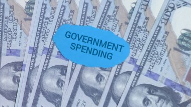 Explore government spending and fiscal policy with this symbolic money shot, ideal for illustrating economic concepts, financial reports, or political commentary.