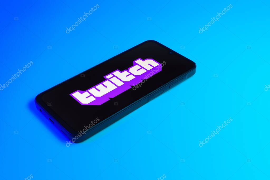 Prague, Czechia - 10 21 2024: Smartphone on surface showing Twitch logo