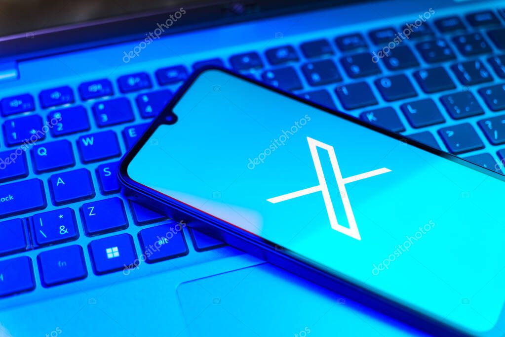 Prague, Czechia - 8 20 2024: Smartphone on surface showing social network X logo