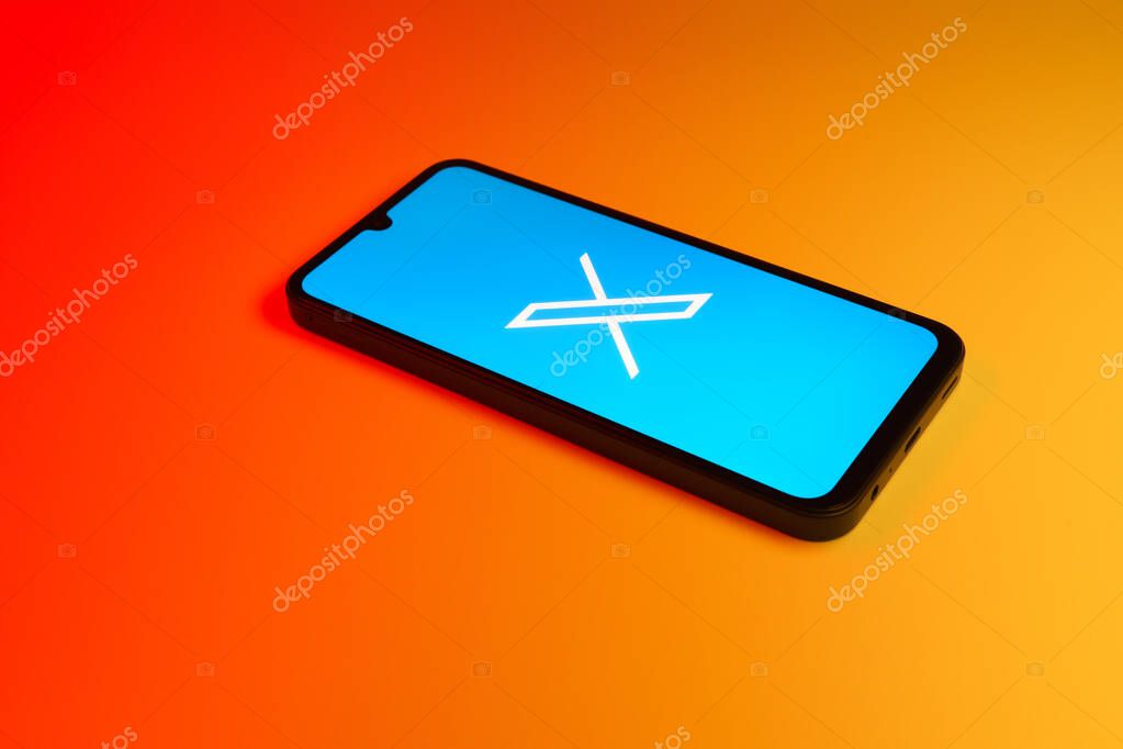 Prague, Czechia - 7 20 2024: Smartphone on surface showing social network X logo.