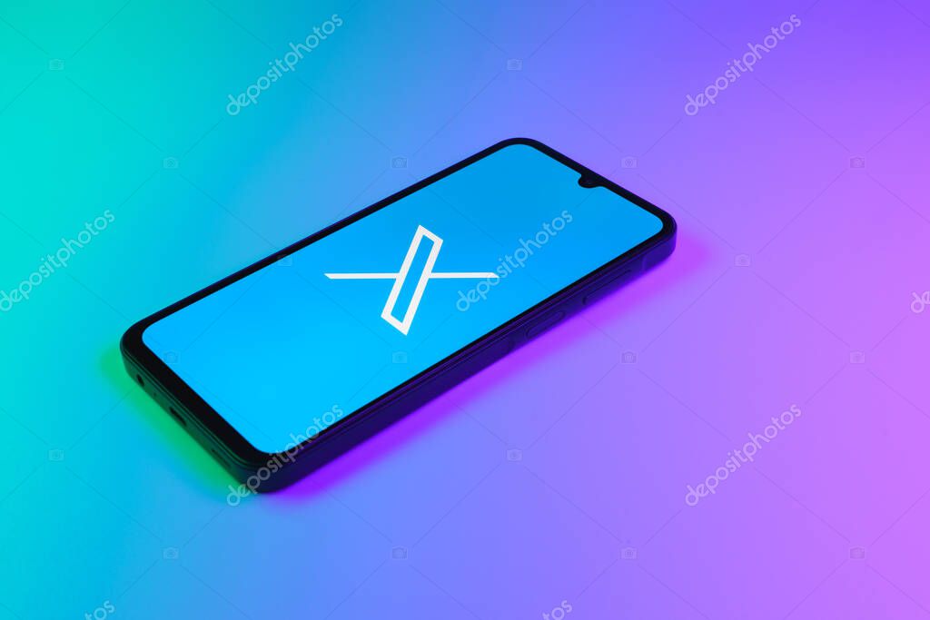 Prague, Czechia - 8 20 2024: Smartphone on surface showing social network X logo.