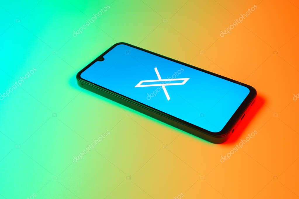 Prague, Czechia - 7 20 2024: Smartphone on surface showing social network X logo.