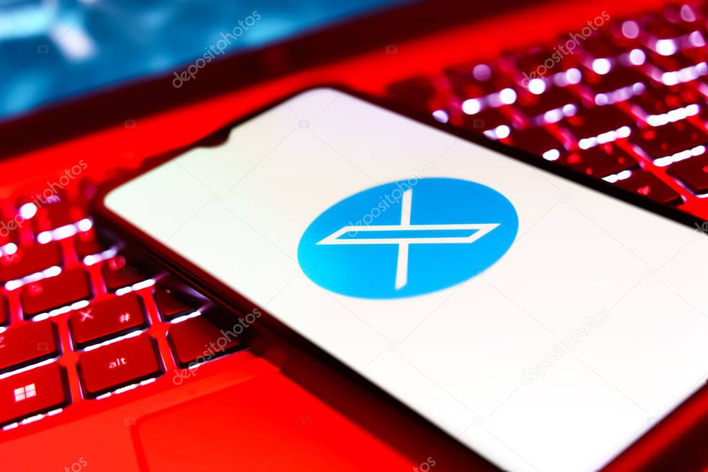 Prague, Czechia - 8 20 2024: Smartphone on surface showing social network X logo.