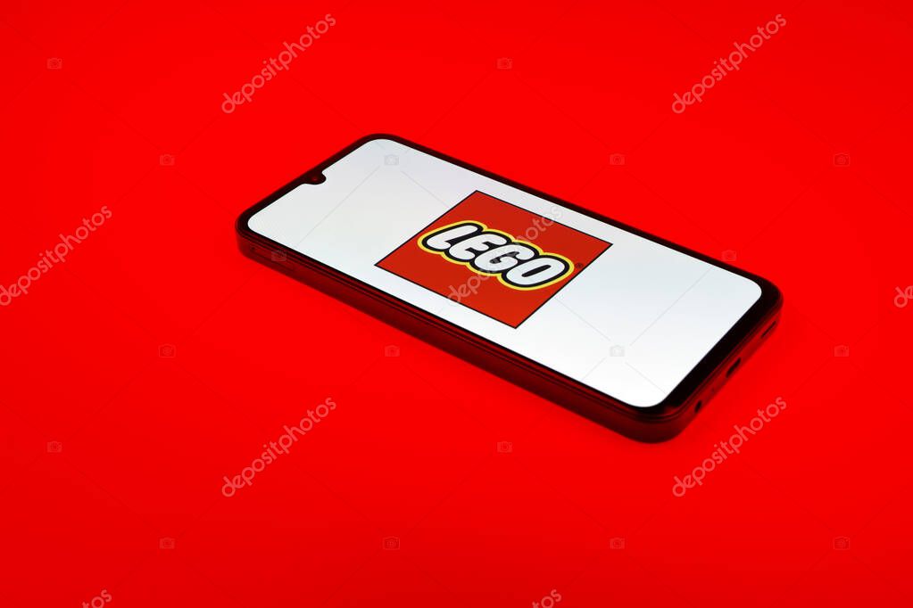 Prague, Czechia - 10 21 2024: Smartphone on surface showing Lego logo.