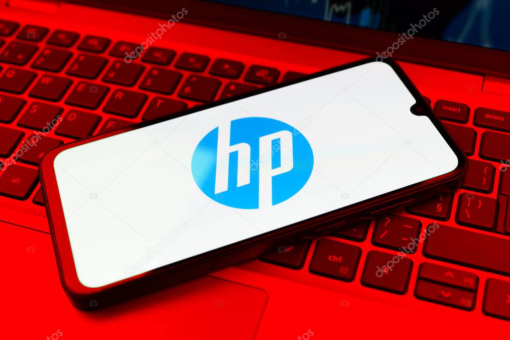 Prague, Czechia - 10 21 2024: Smartphone on surface showing Hewlett-Packard logo.