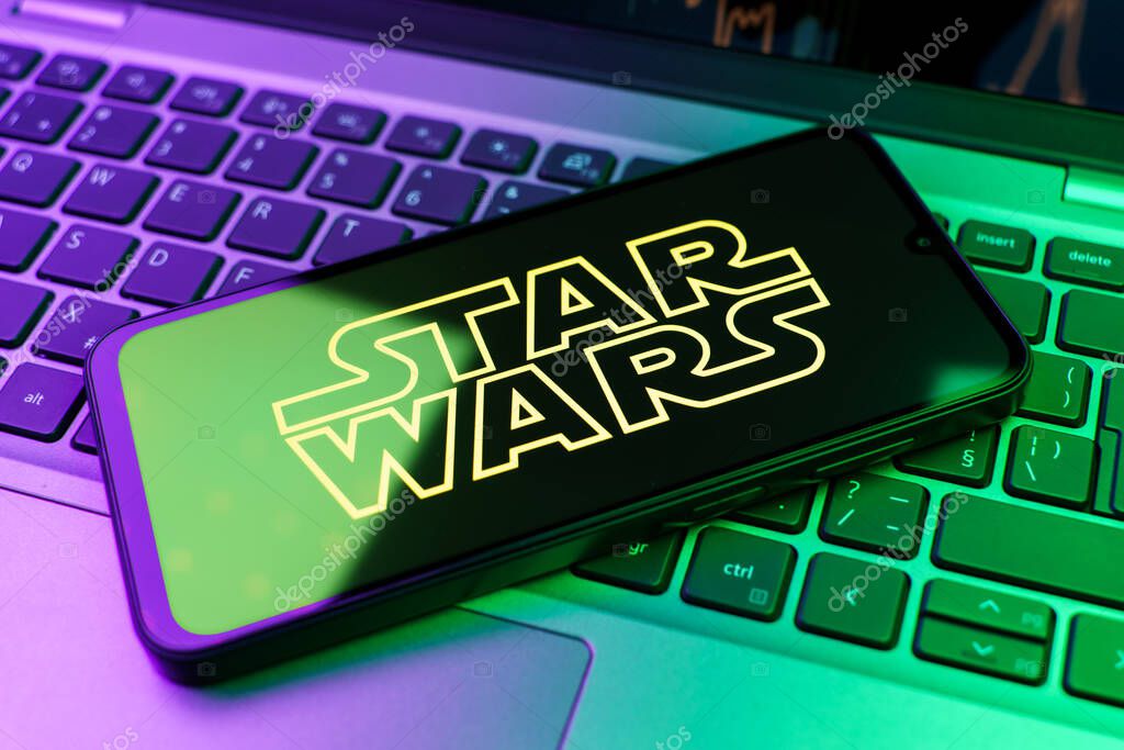 Prague, Czechia - 10 21 2024: Smartphone on surface showing Star Wars logo.