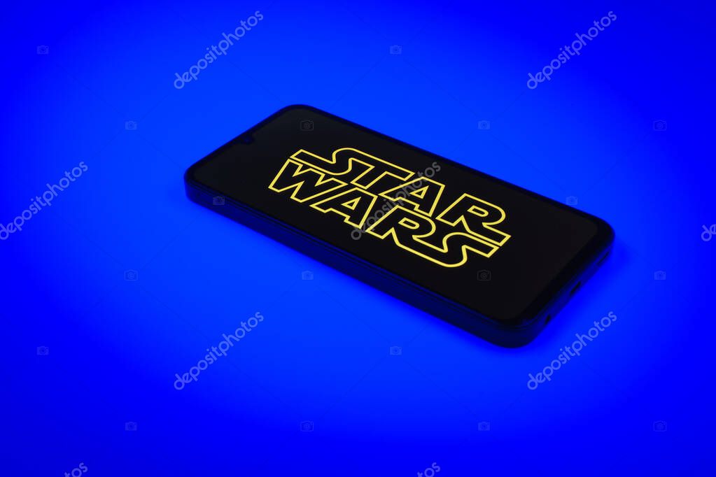 Prague, Czechia - 10 21 2024: Smartphone on surface showing Star Wars logo.