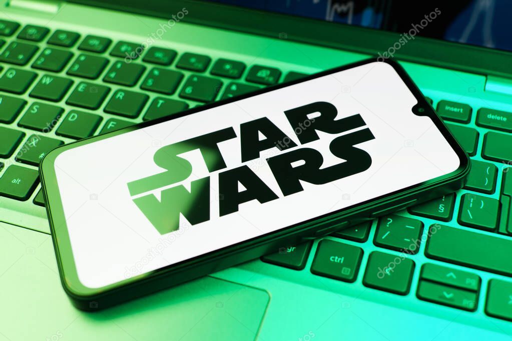 Prague, Czechia - 10 21 2024: Smartphone on surface showing Star Wars logo.
