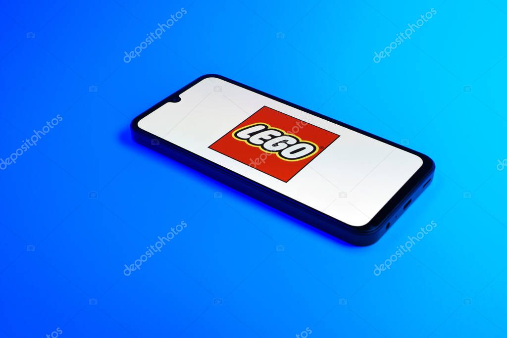 Prague, Czechia - 10 21 2024: Smartphone on surface showing Lego logo.