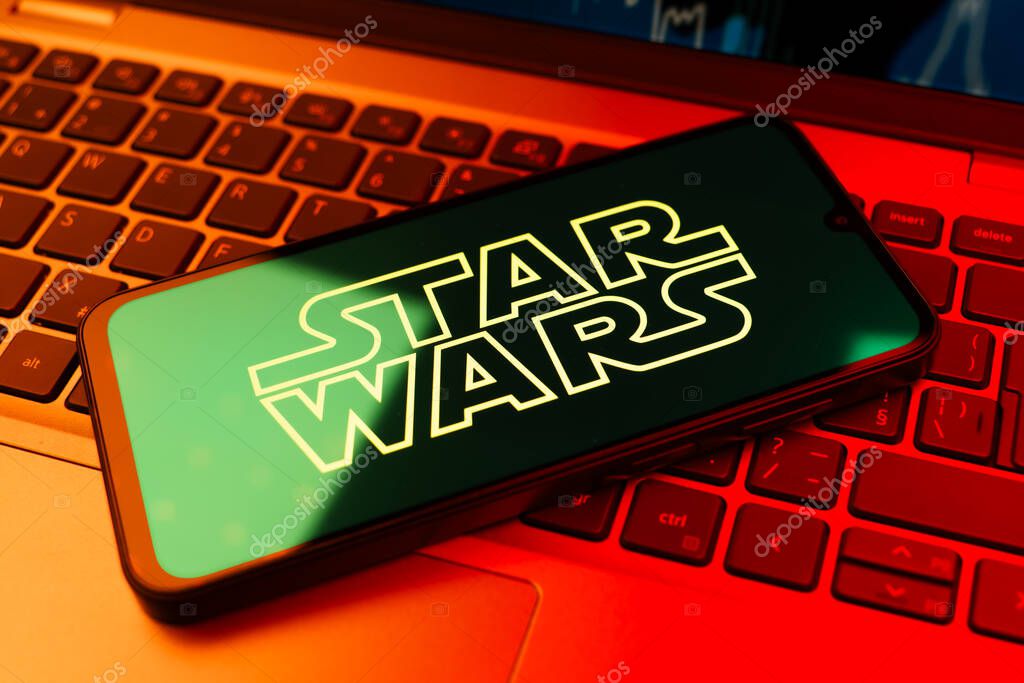 Prague, Czechia - 10 21 2024: Smartphone on surface showing Star Wars logo.