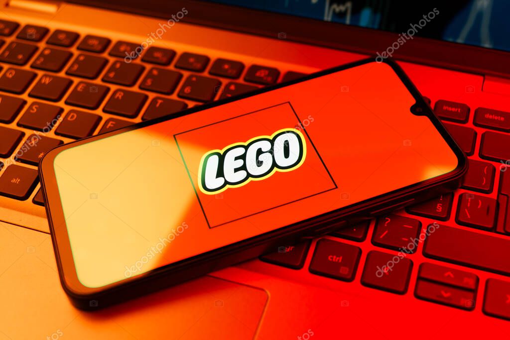 Prague, Czechia - 10 21 2024: Smartphone on surface showing Lego logo.