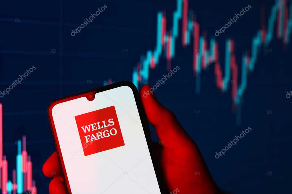 Prague, Czechia - 10 21 2024: Smartphone on surface showing Wells Fargo logo.