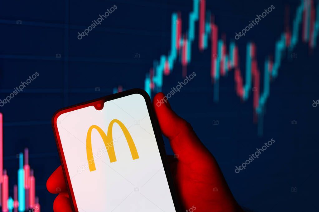 Prague, Czechia - 10 21 2024: Smartphone on surface showing McDonalds logo.