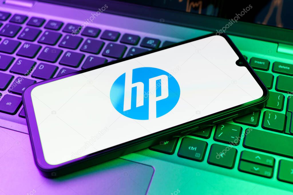 Prague, Czechia - 10 21 2024: Smartphone on surface showing Hewlett-Packard logo.