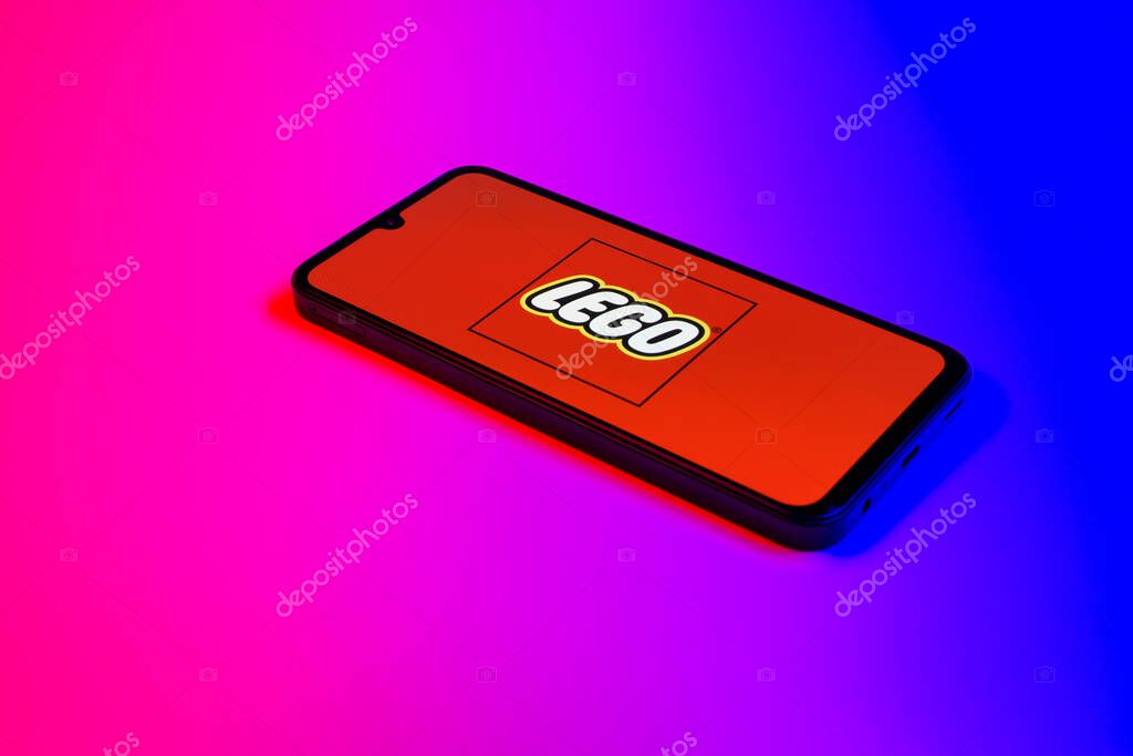 Prague, Czechia - 10 21 2024: Smartphone on surface showing Lego logo.