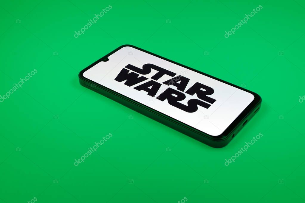 Prague, Czechia - 10 21 2024: Smartphone on surface showing Star Wars logo.