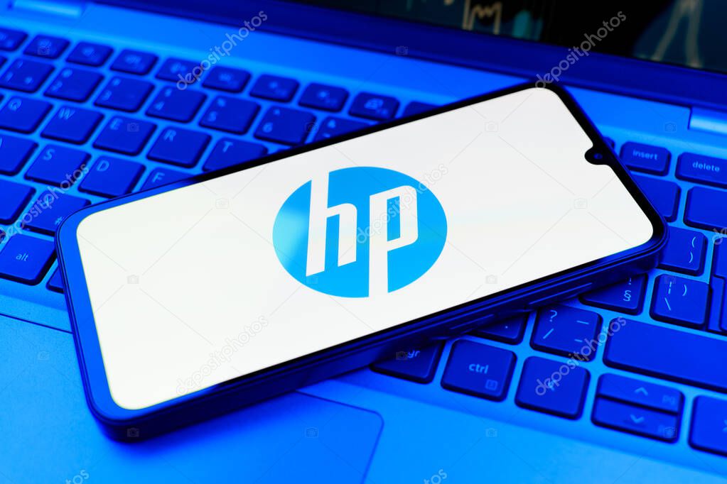 Prague, Czechia - 10 21 2024: Smartphone on surface showing Hewlett-Packard logo.