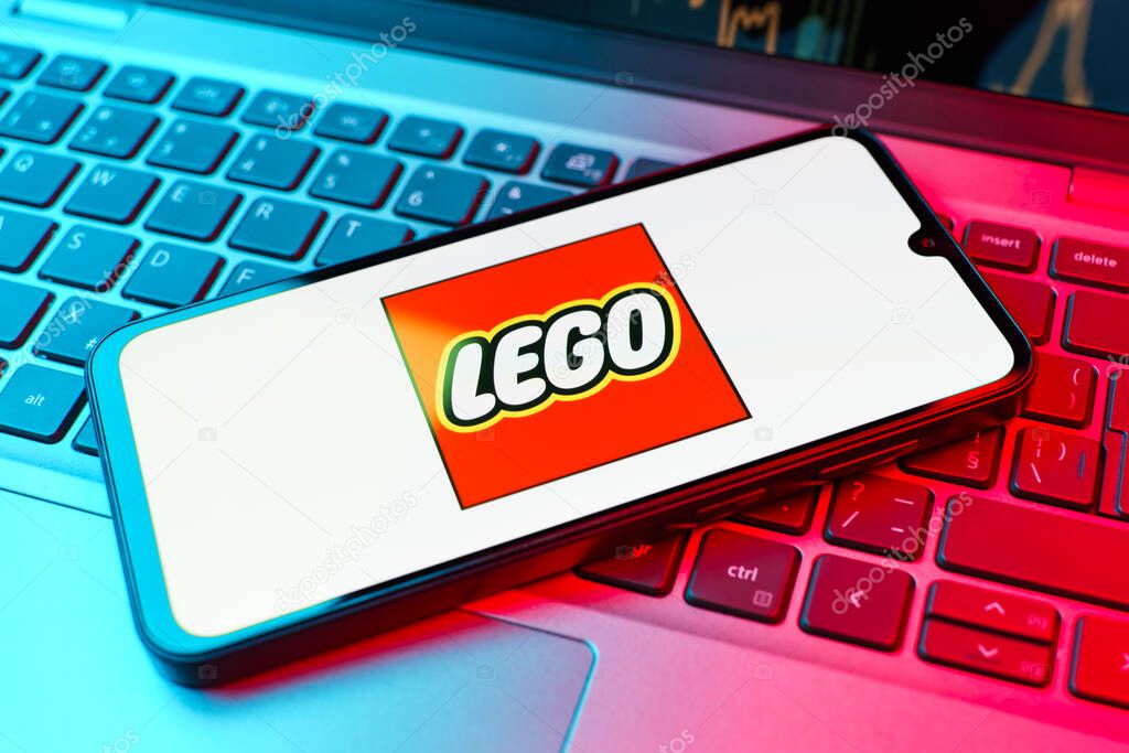 Prague, Czechia - 10 21 2024: Smartphone on surface showing Lego logo.
