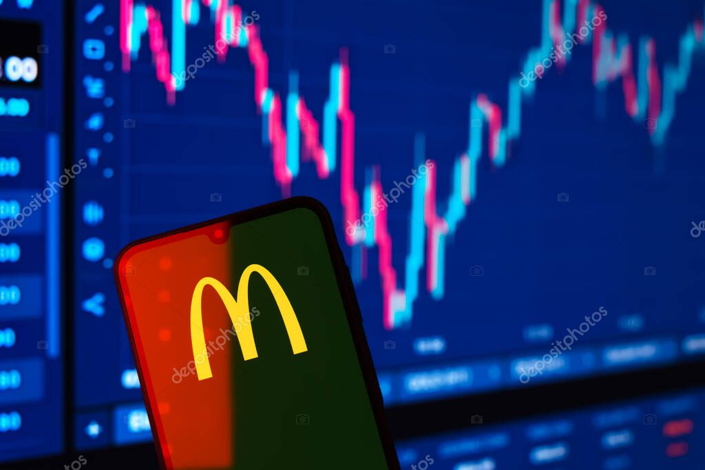 Prague, Czechia - 10 21 2024: Smartphone on surface showing McDonalds logo.