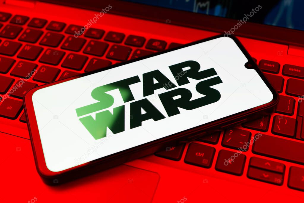 Prague, Czechia - 10 21 2024: Smartphone on surface showing Star Wars logo.