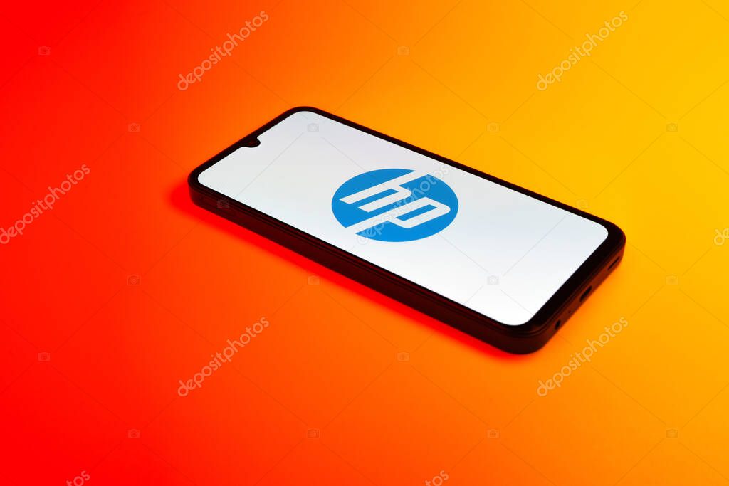Prague, Czechia - 10 21 2024: Smartphone on surface showing Hewlett-Packard logo.