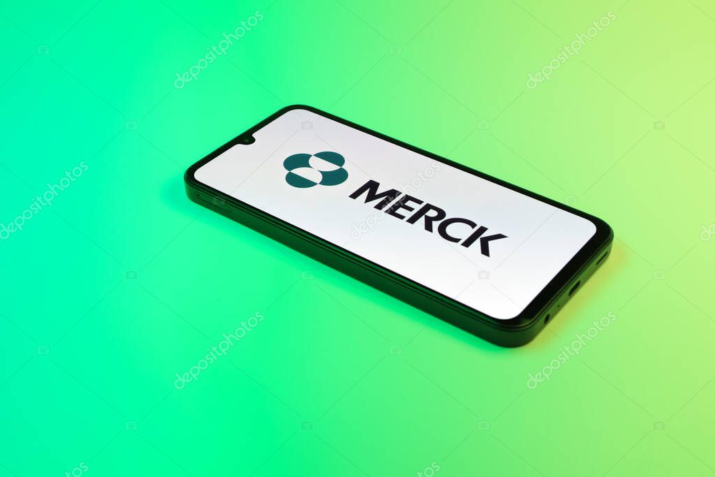 Prague, Czechia - 10 21 2024: Smartphone on surface showing Merck logo.