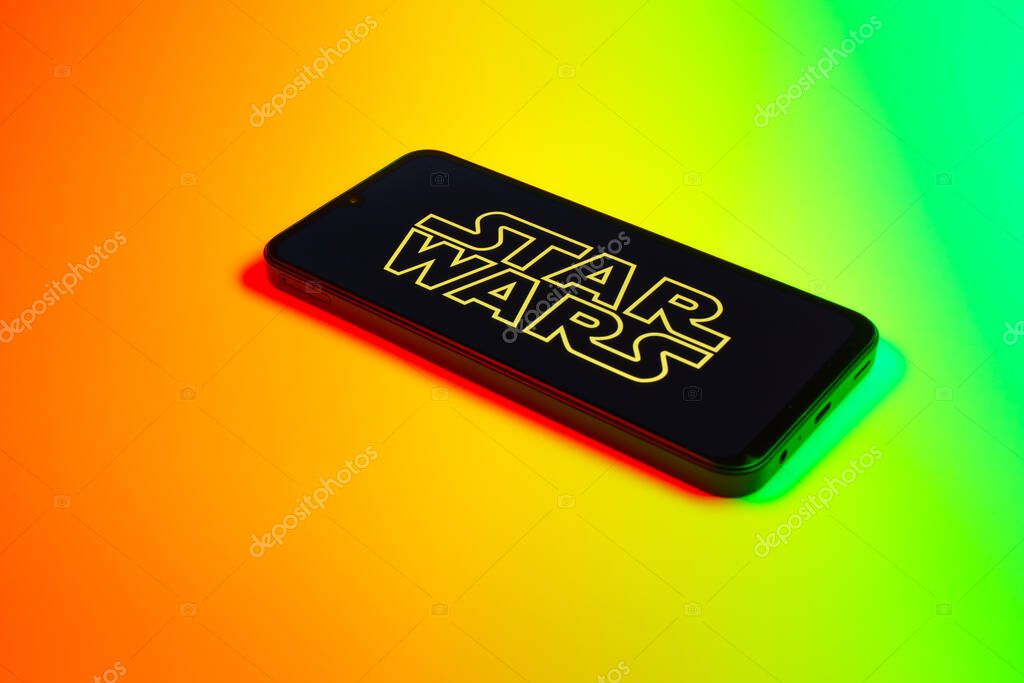 Prague, Czechia - 10 21 2024: Smartphone on surface showing Star Wars logo.