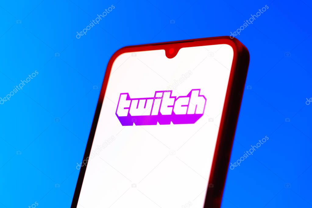 Prague, Czechia - 10 21 2024: Smartphone on surface showing Twitch logo.