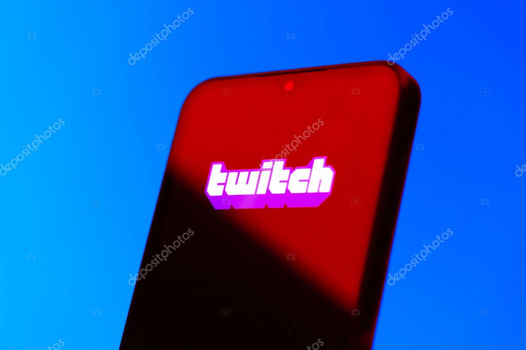 Prague, Czechia - 10 21 2024: Smartphone on surface showing Twitch logo.