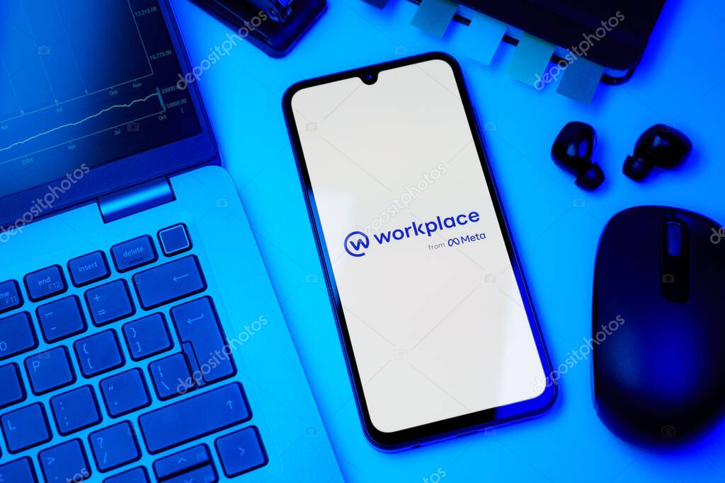 Prague, Czechia - 10 21 2024: Smartphone on surface showing Workplace logo.