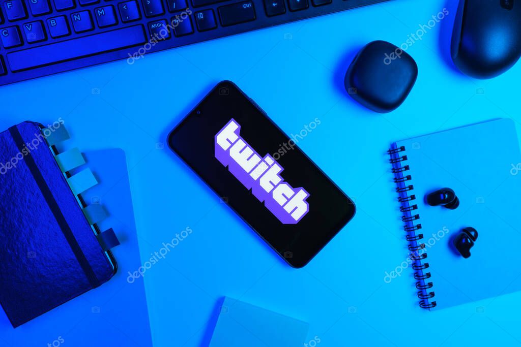 Prague, Czechia - 10 21 2024: Smartphone on surface showing Twitch logo.