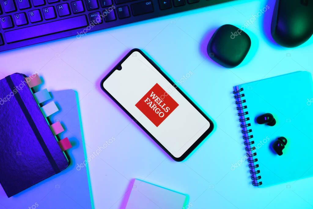 Prague, Czechia - 10 21 2024: Smartphone on surface showing Wells Fargo logo.