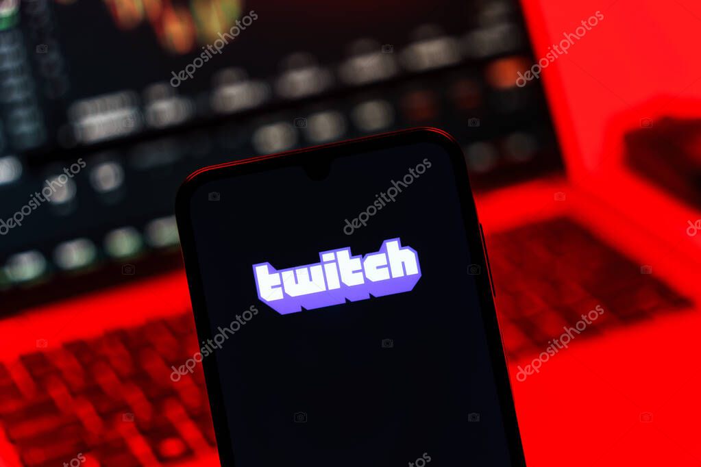 Prague, Czechia - 10 21 2024: Smartphone on surface showing Twitch logo.