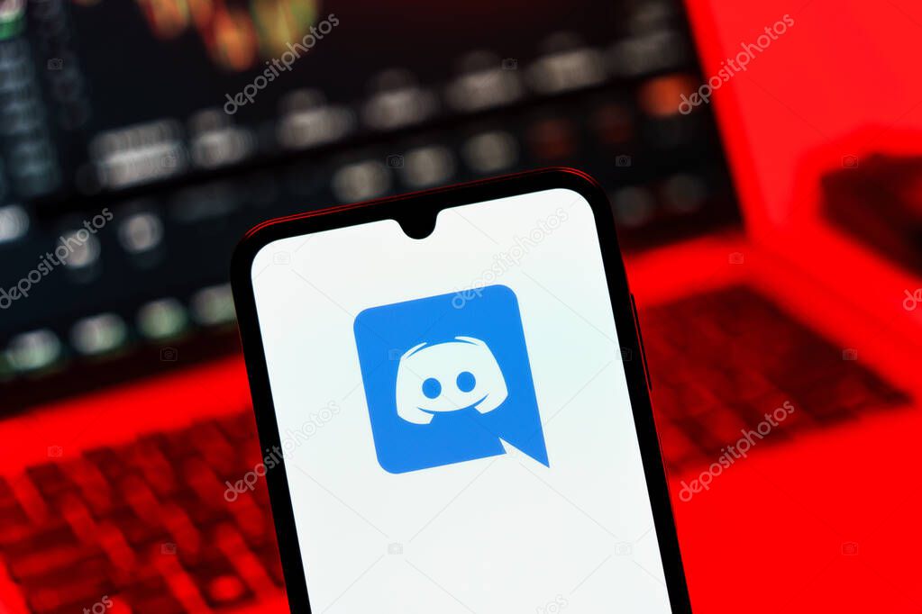 Prague, Czechia - 10 21 2024: Smartphone on surface showing Discord logo.