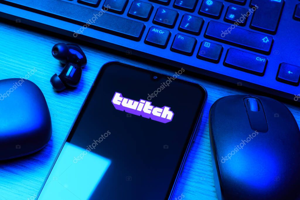 Prague, Czechia - 10 21 2024: Smartphone on surface showing Twitch logo.