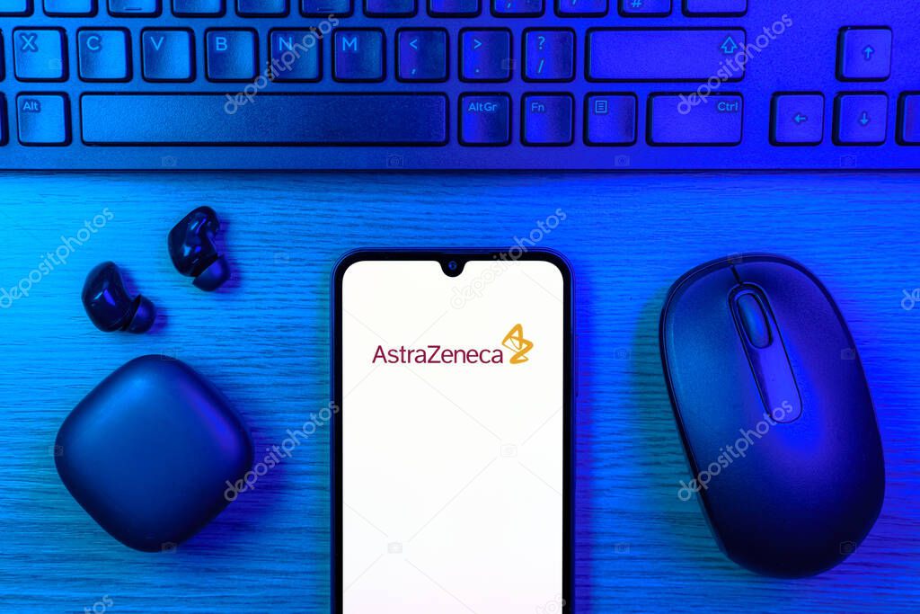 Prague, Czechia - 10 21 2024: Smartphone on surface showing AstraZeneca logo.