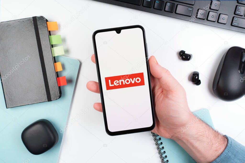 Prague, Czechia - 10 21 2024: Smartphone on surface showing Lenovo logo.