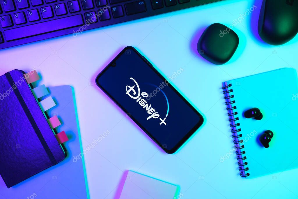 Prague, Czechia - 10 21 2024: Smartphone on surface showing Disney + logo.