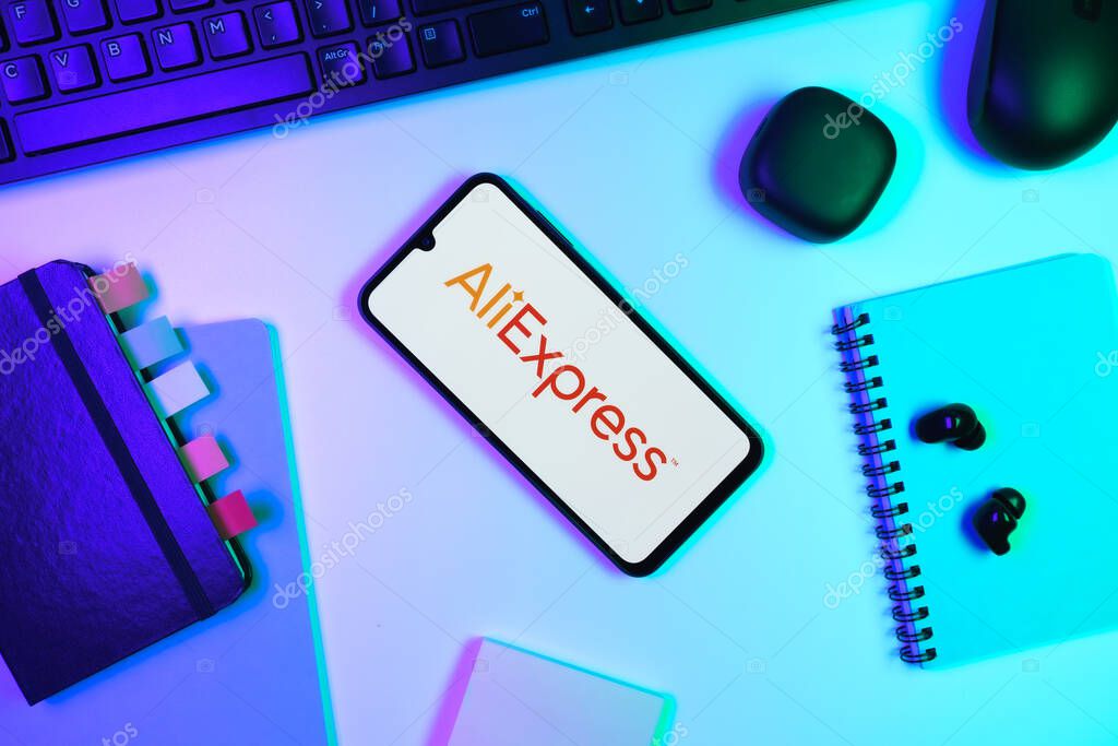 Prague, Czechia - 10 21 2024: Smartphone on surface showing AliExpress logo.