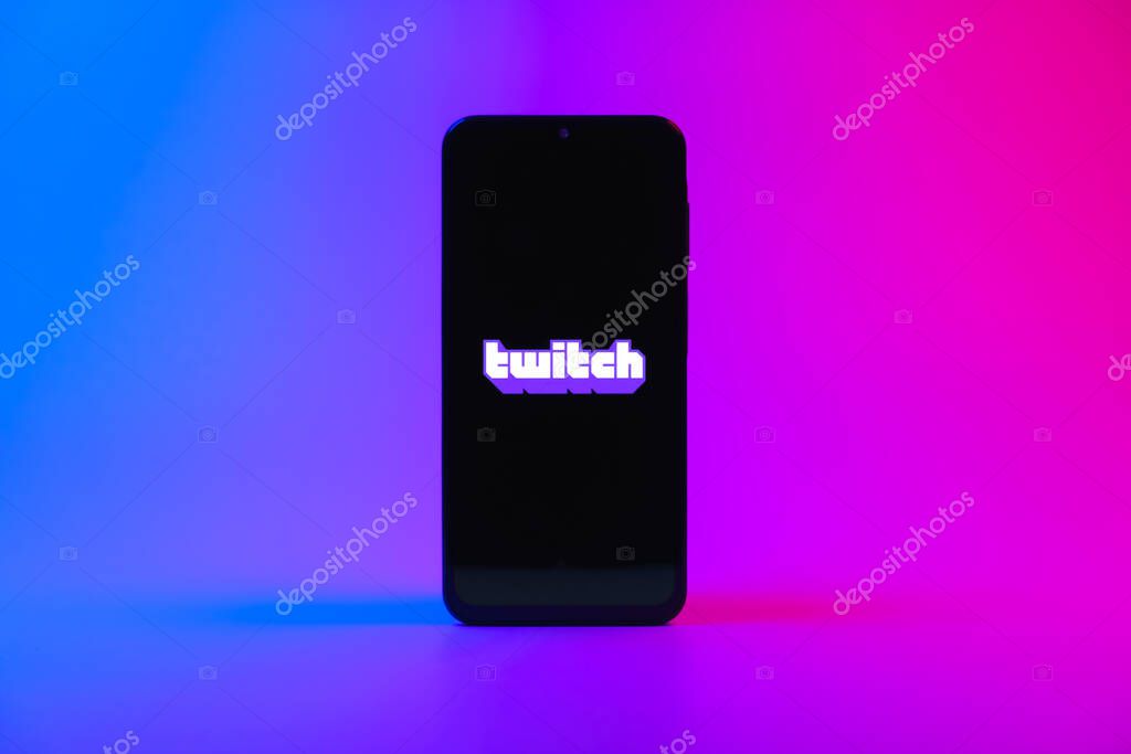Prague, Czechia - 10 21 2024: Smartphone on surface showing Twitch logo.